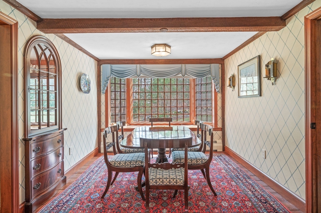 15 Woodland Road Boxford, MA 01921 - Photo 6 of 38 a view of a dining room with furniture wooden floor and front door