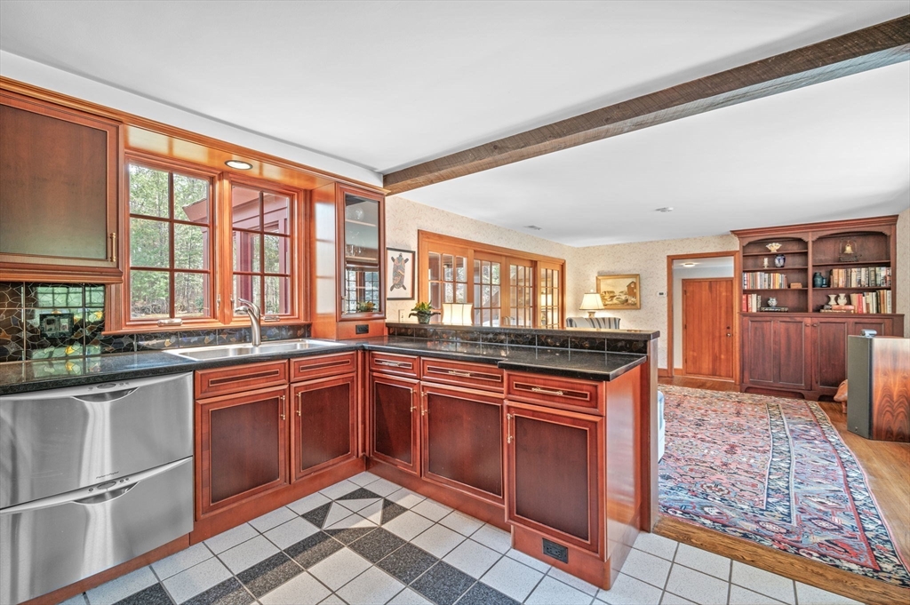 15 Woodland Road Boxford, MA 01921 - Photo 10 of 38 a kitchen with stainless steel appliances granite countertop a stove a sink and a refrigerator