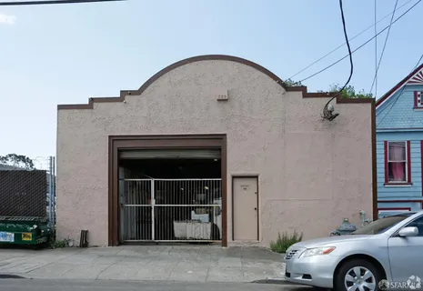 a front view of a house with parking space