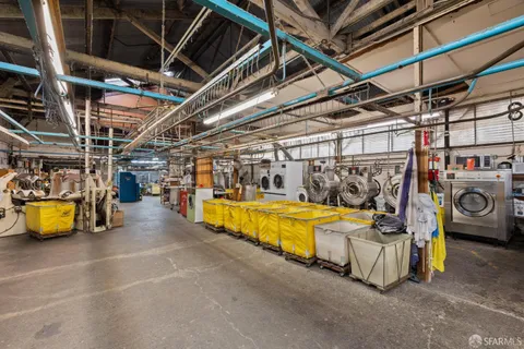 a view of a garage with wooden chairs