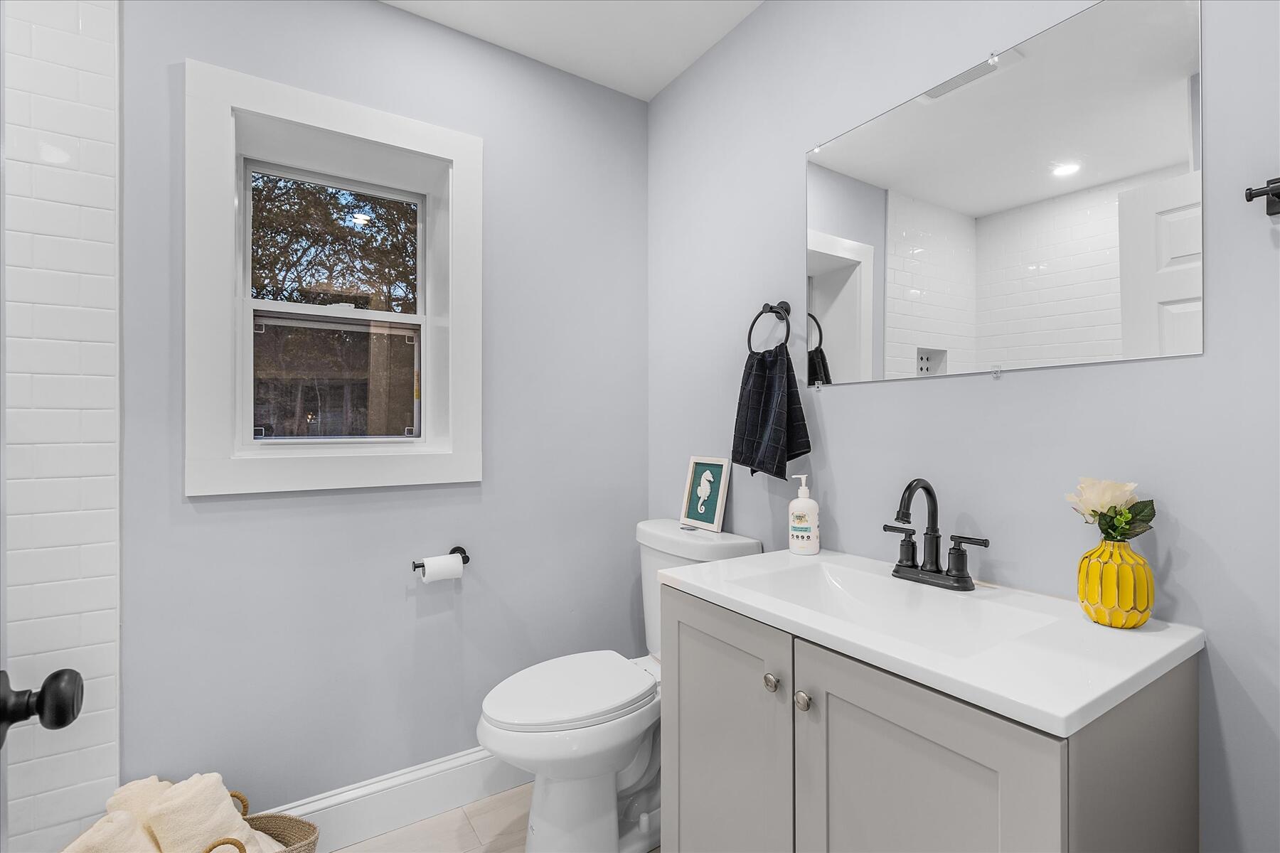15 Shannon Road Harwich, MA 02645 - Photo 11 of 21 a bathroom with a toilet sink and mirror