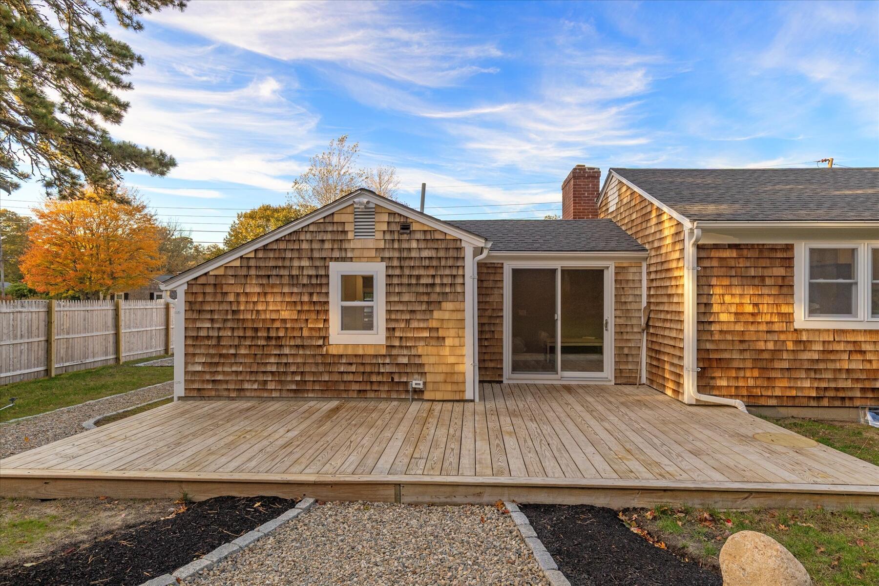 15 Shannon Road Harwich, MA 02645 - Photo 19 of 21 a front view of a house with a garden