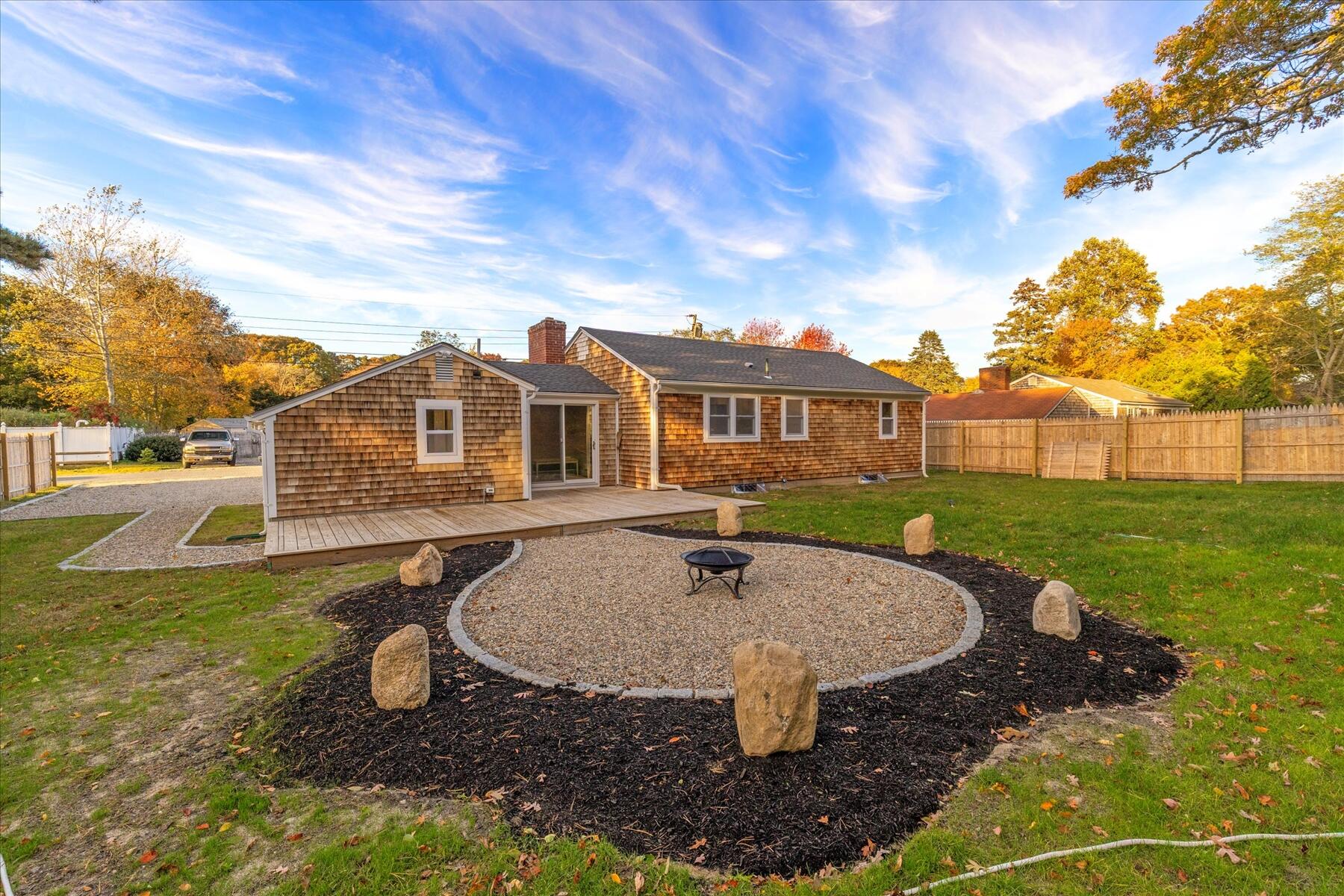 15 Shannon Road Harwich, MA 02645 - Photo 20 of 21 a view of a house with backyard porch and garden