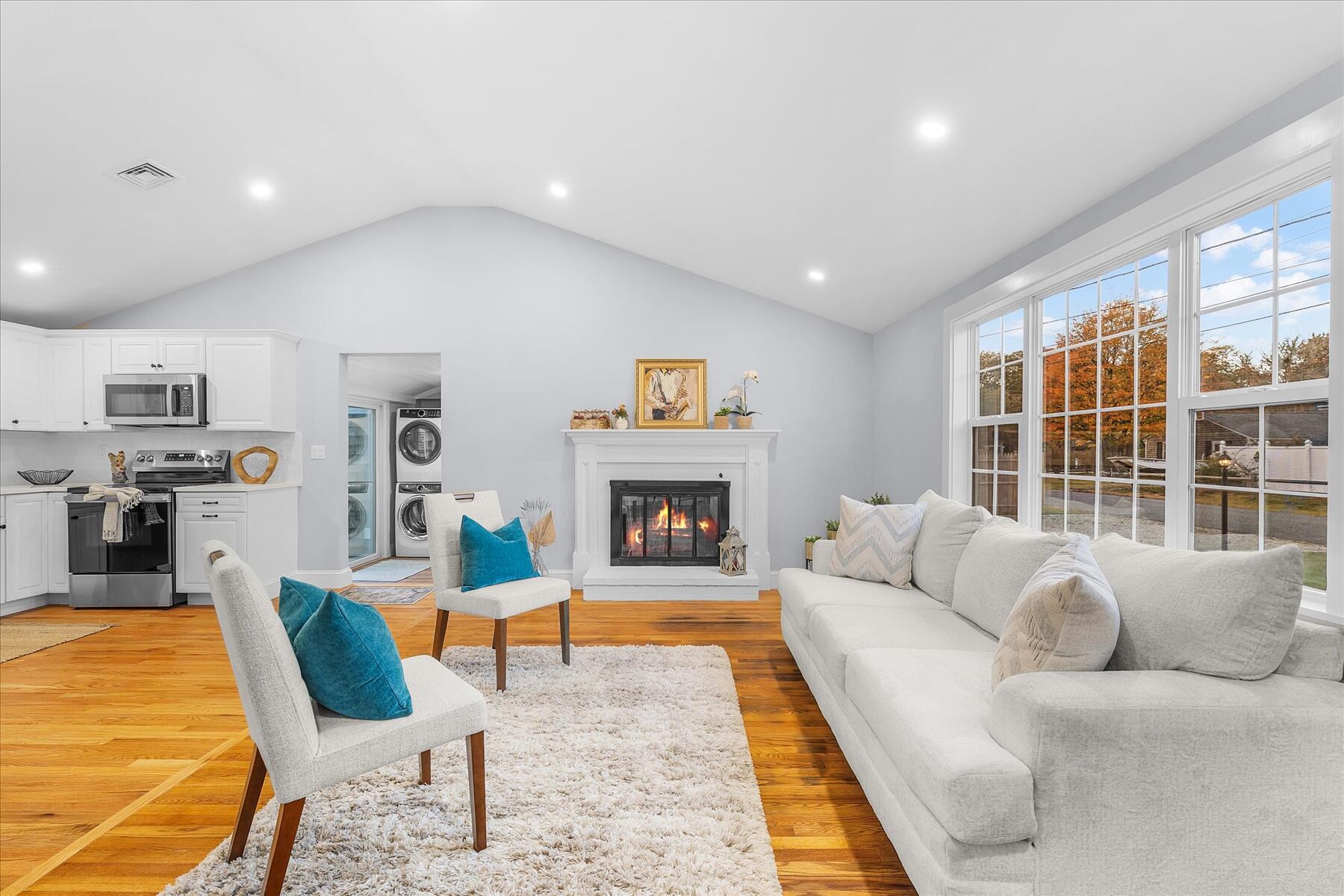 15 Shannon Road Harwich, MA 02645 - Photo 5 of 21 a living room with furniture and a fireplace