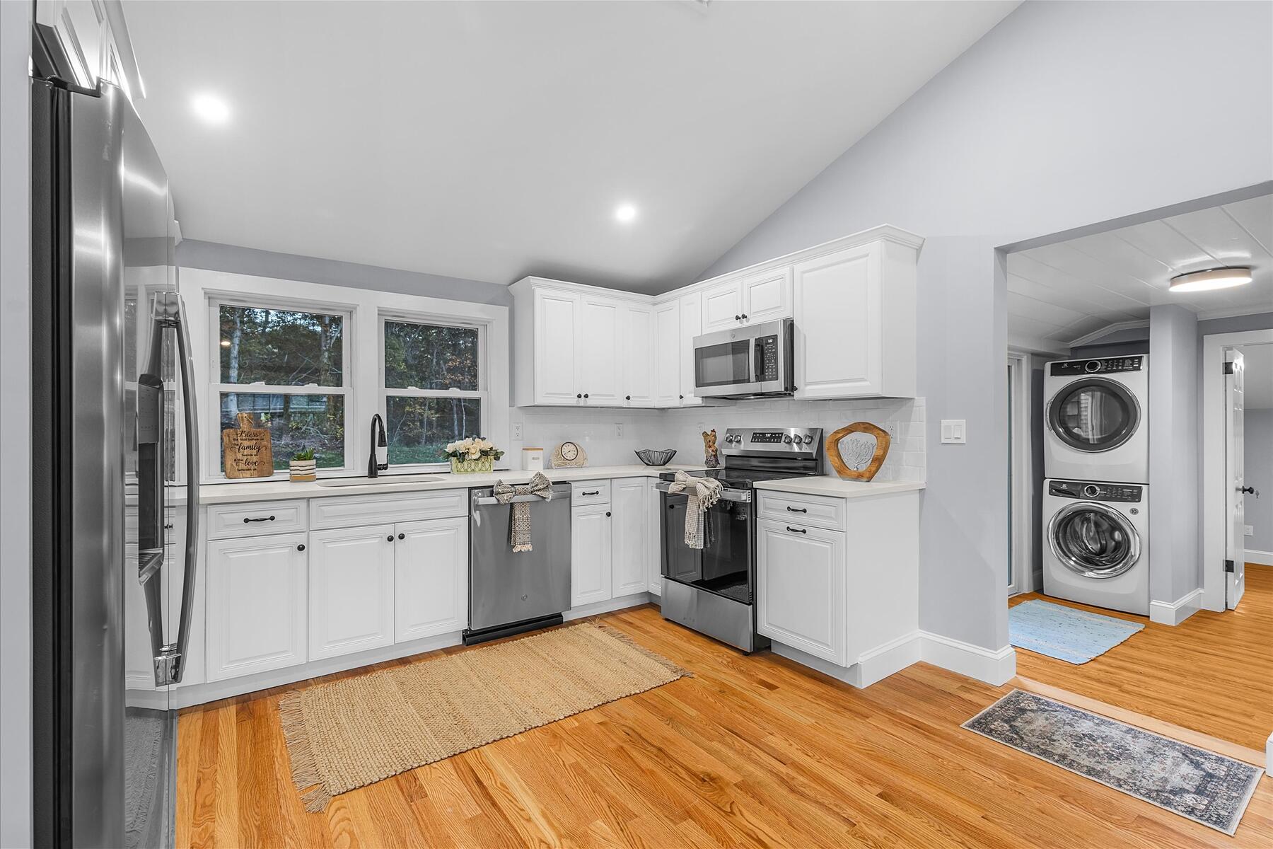 15 Shannon Road Harwich, MA 02645 - Photo 7 of 21 a kitchen with stainless steel appliances granite countertop a refrigerator and stove top oven