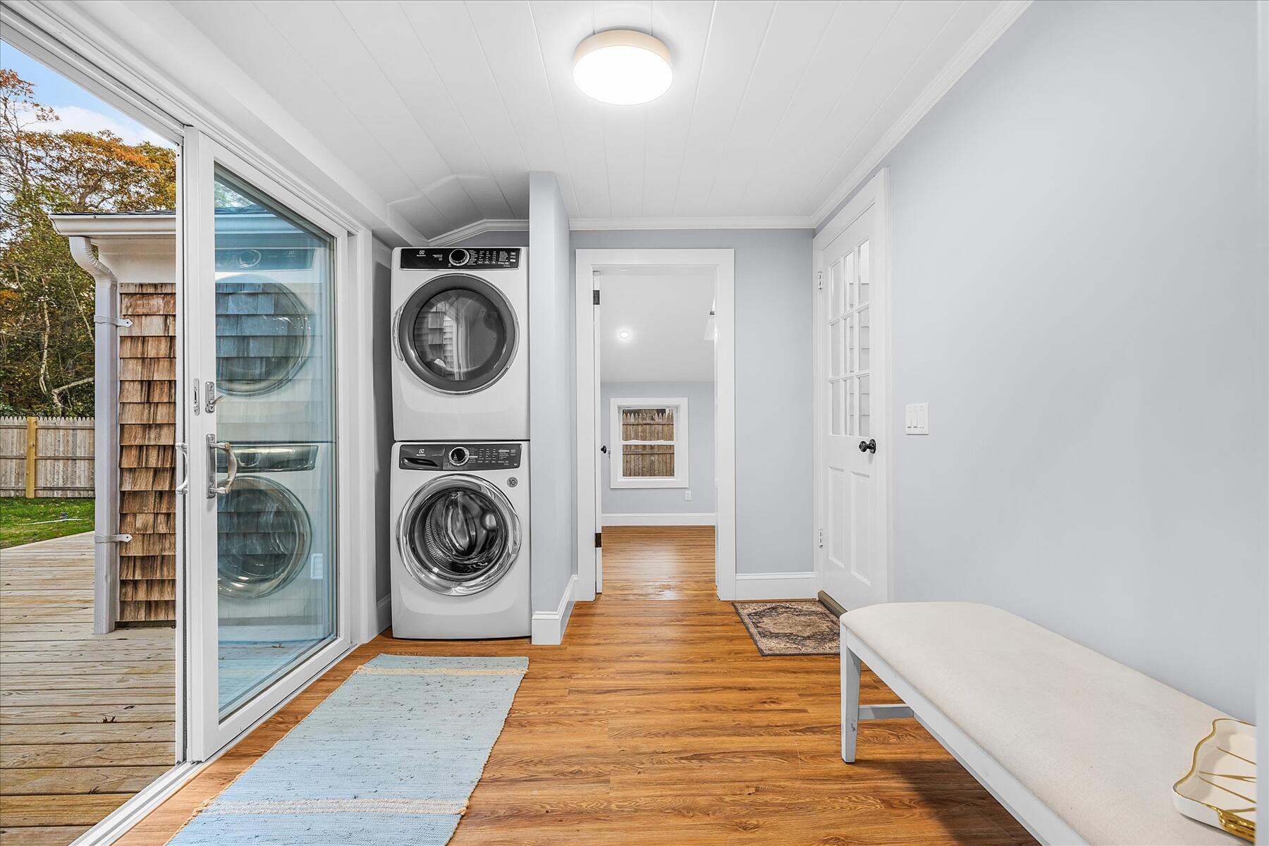 15 Shannon Road Harwich, MA 02645 - Photo 8 of 21 a view of a hallway with washer and dryer