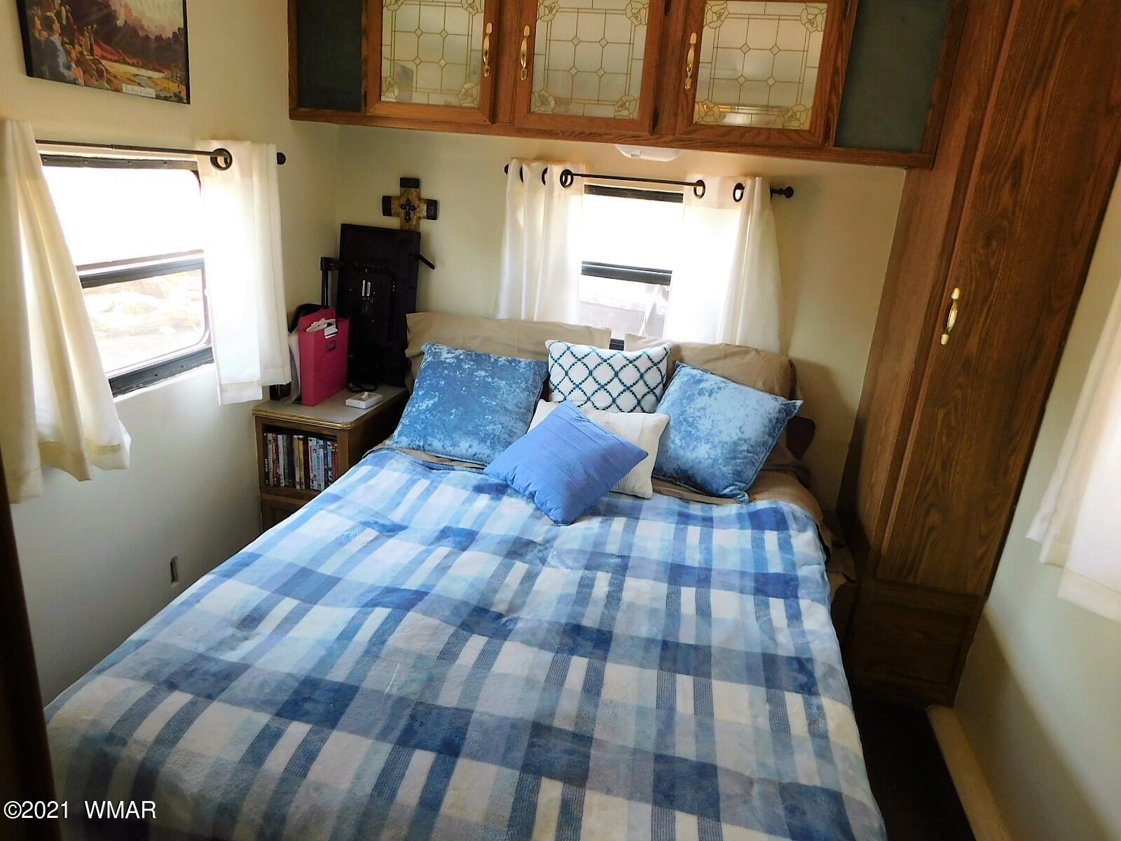 Tbd Aleosa Way Show Low, AZ 85901 - Photo 2 of 27 a bedroom with a bed and wooden floor