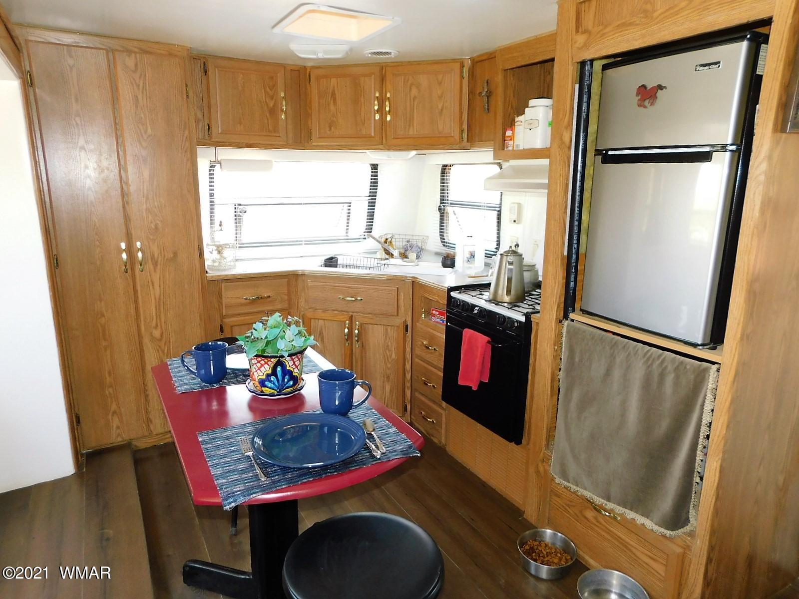 Tbd Aleosa Way Show Low, AZ 85901 - Photo 7 of 27 a kitchen with a refrigerator and a table