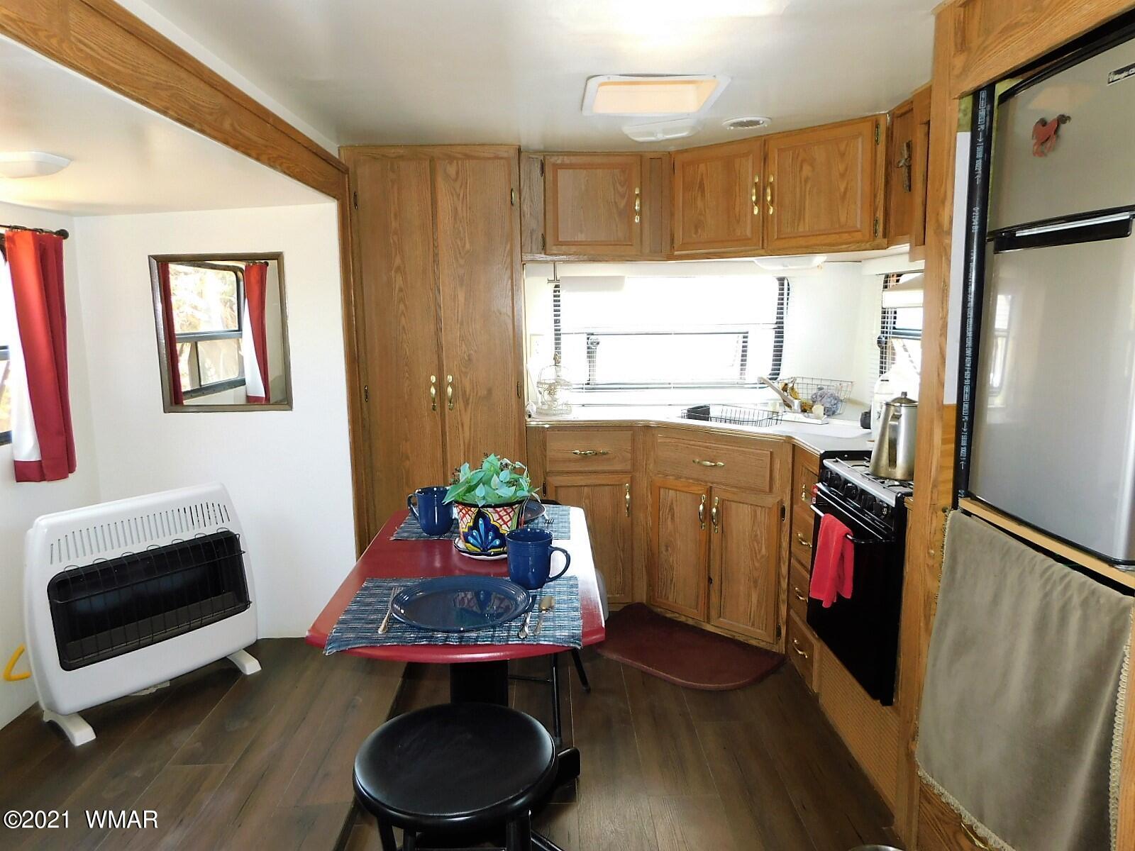Tbd Aleosa Way Show Low, AZ 85901 - Photo 8 of 27 a kitchen with stainless steel appliances a stove a refrigerator and a dining table