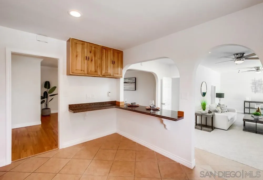 2051 Ridge View Drive San Diego, CA 92105 - Photo 21 of 51 a hallway with a table and sofas