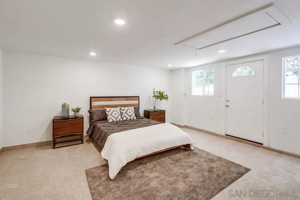 2051 Ridge View Drive San Diego, CA 92105 - Photo 23 of 51 a bedroom with a bed and a couch