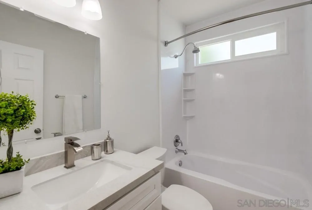 2051 Ridge View Drive San Diego, CA 92105 - Photo 29 of 51 a bathroom with a granite countertop sink toilet and shower