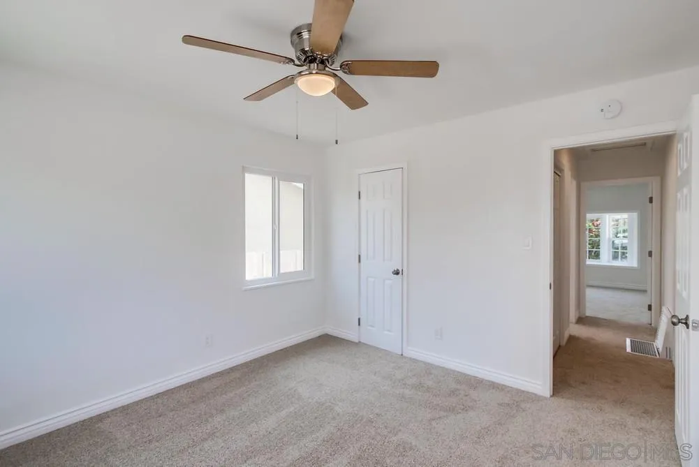 2051 Ridge View Drive San Diego, CA 92105 - Photo 32 of 51 wooden floor in an empty room with a window