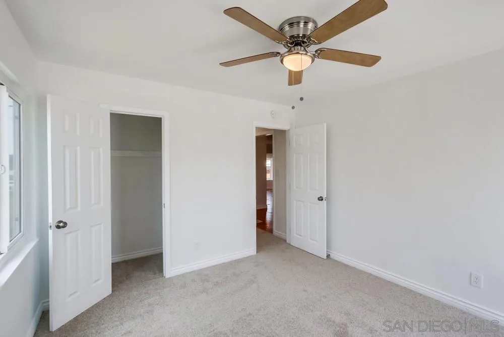 2051 Ridge View Drive San Diego, CA 92105 - Photo 33 of 51 an empty room with a ceiling fan and a window