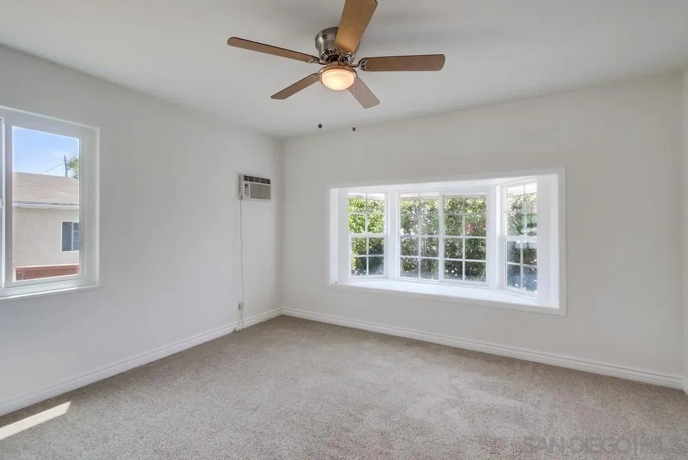 2051 Ridge View Drive San Diego, CA 92105 - Photo 35 of 51 an empty room with a window and a fan