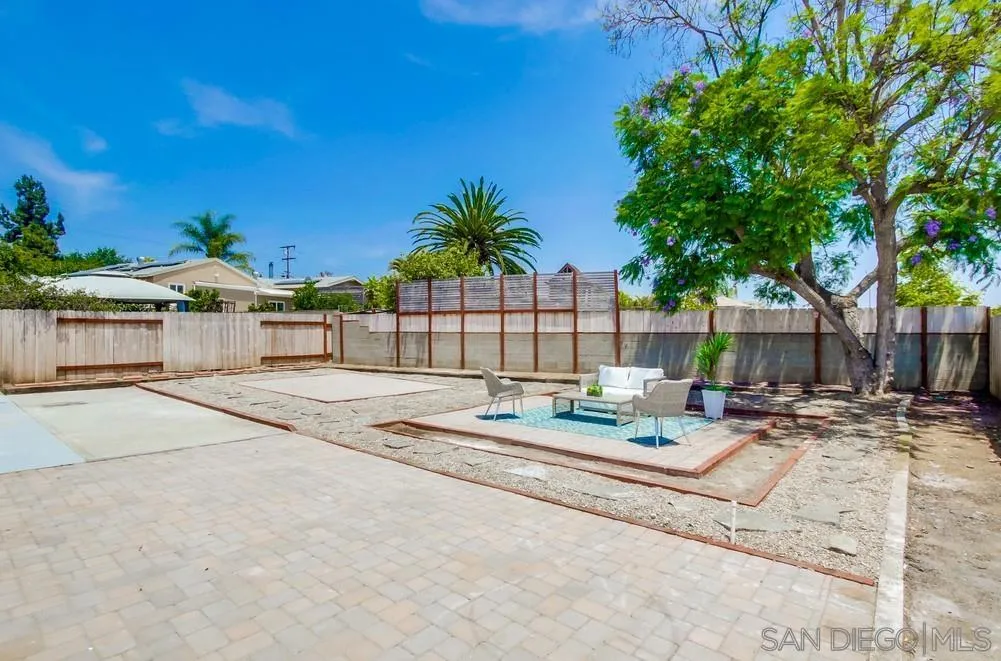 2051 Ridge View Drive San Diego, CA 92105 - Photo 48 of 51 a view of pool with lawn chairs and wooden fence