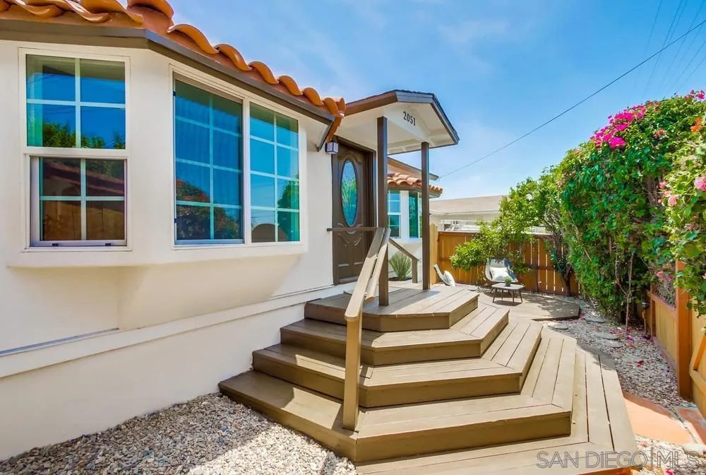 2051 Ridge View Drive San Diego, CA 92105 - Photo 5 of 51 a front view of a house with entryway and garden