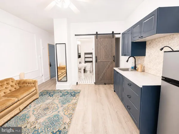a spacious bathroom with a double vanity sink and a mirror
