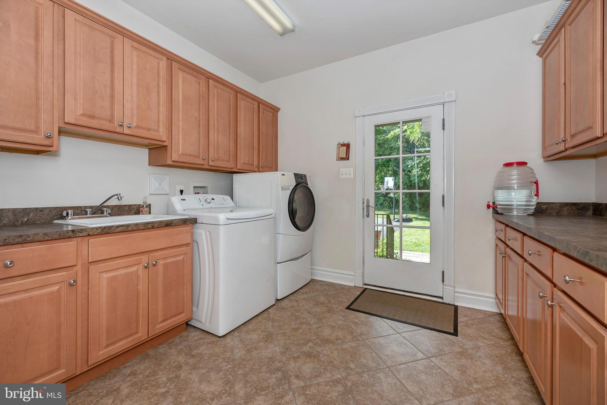 7525 Old Receiver Road Frederick, MD 21702 - Photo 20 of 63 Laundry Room w/ Sink and Extra Cabinetry Space