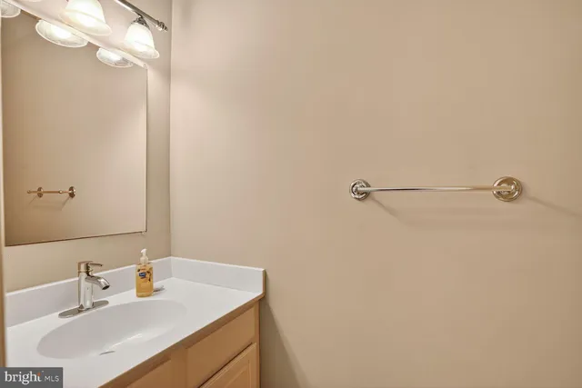 a view of an empty room with a fireplace and a large window