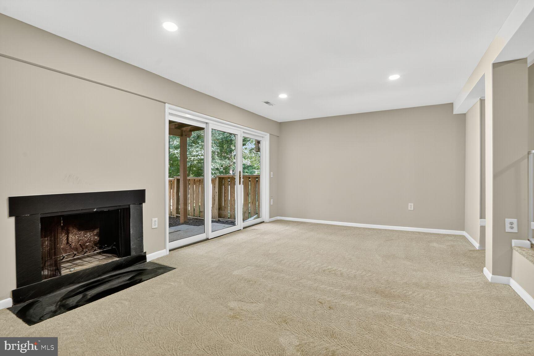 11690 Generation Court Reston, VA 20191 - Photo 22 of 24 Spacious living area with serene outdoor access.