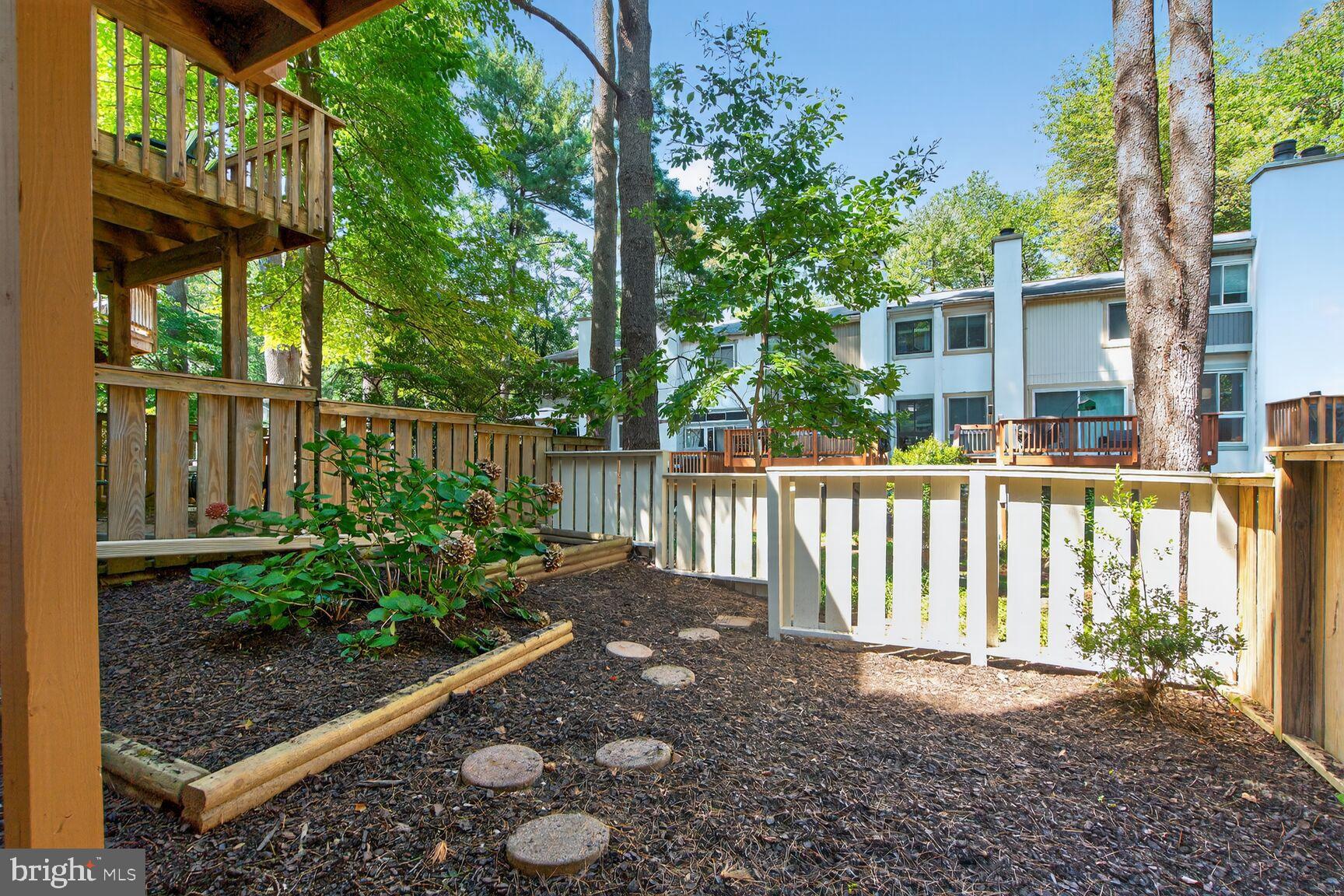 11690 Generation Court Reston, VA 20191 - Photo 23 of 24 Serene backyard garden with stone pathway