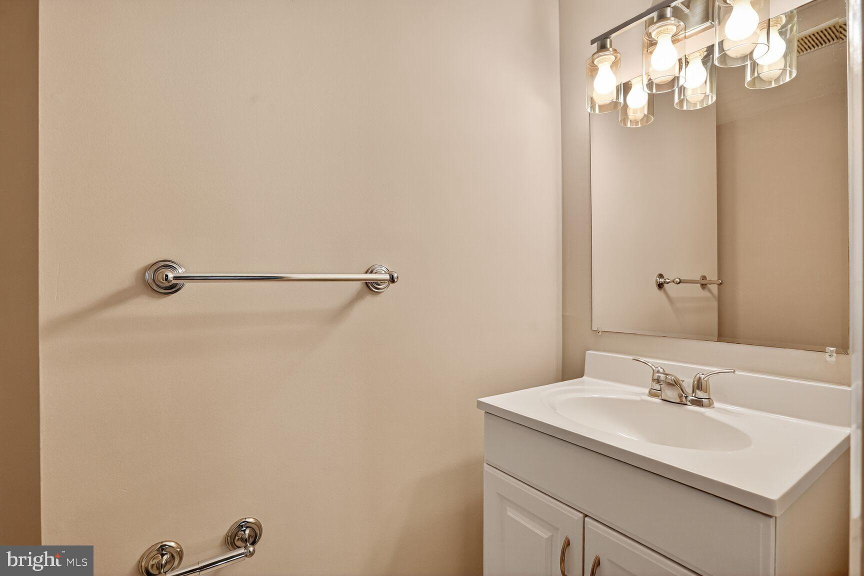 11690 Generation Court Reston, VA 20191 - Photo 10 of 24 Bright and modern powder room with sleek fixtures.