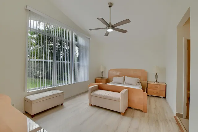a bedroom with furniture and a window
