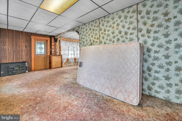 a view of an empty room with a fireplace