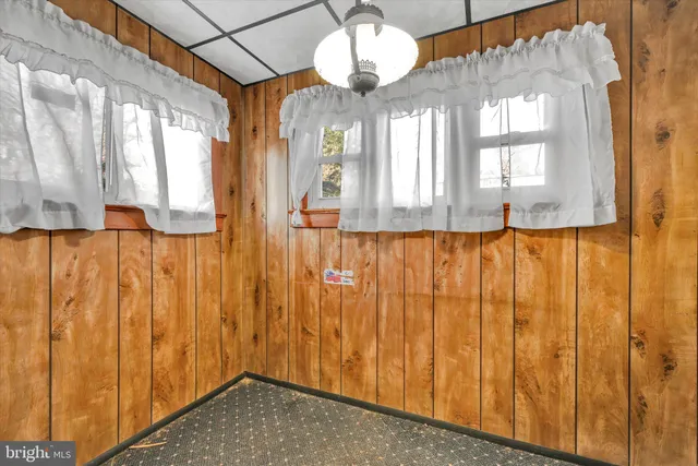 a bathroom with a large window and shower