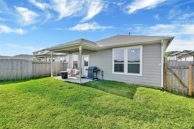 a view of a house with backyard porch and garden