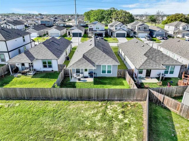 a view of multiple houses with a yard