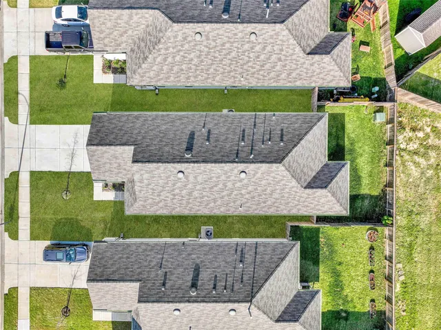 an aerial view of a house with a garden