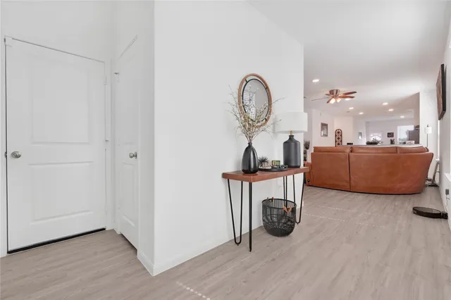 a view of a livingroom with furniture and a mirror