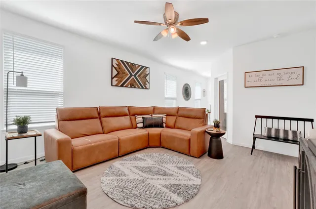 a living room with furniture and a window