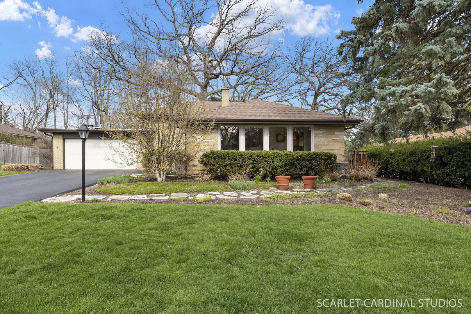 a front view of house with yard and green space