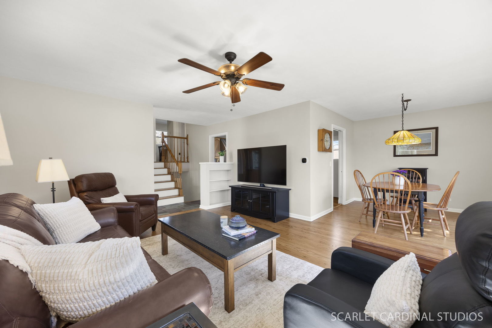 9 Notre Dame Drive Naperville, IL 60540 - Photo 3 of 24 a living room with furniture a flat screen tv and a window