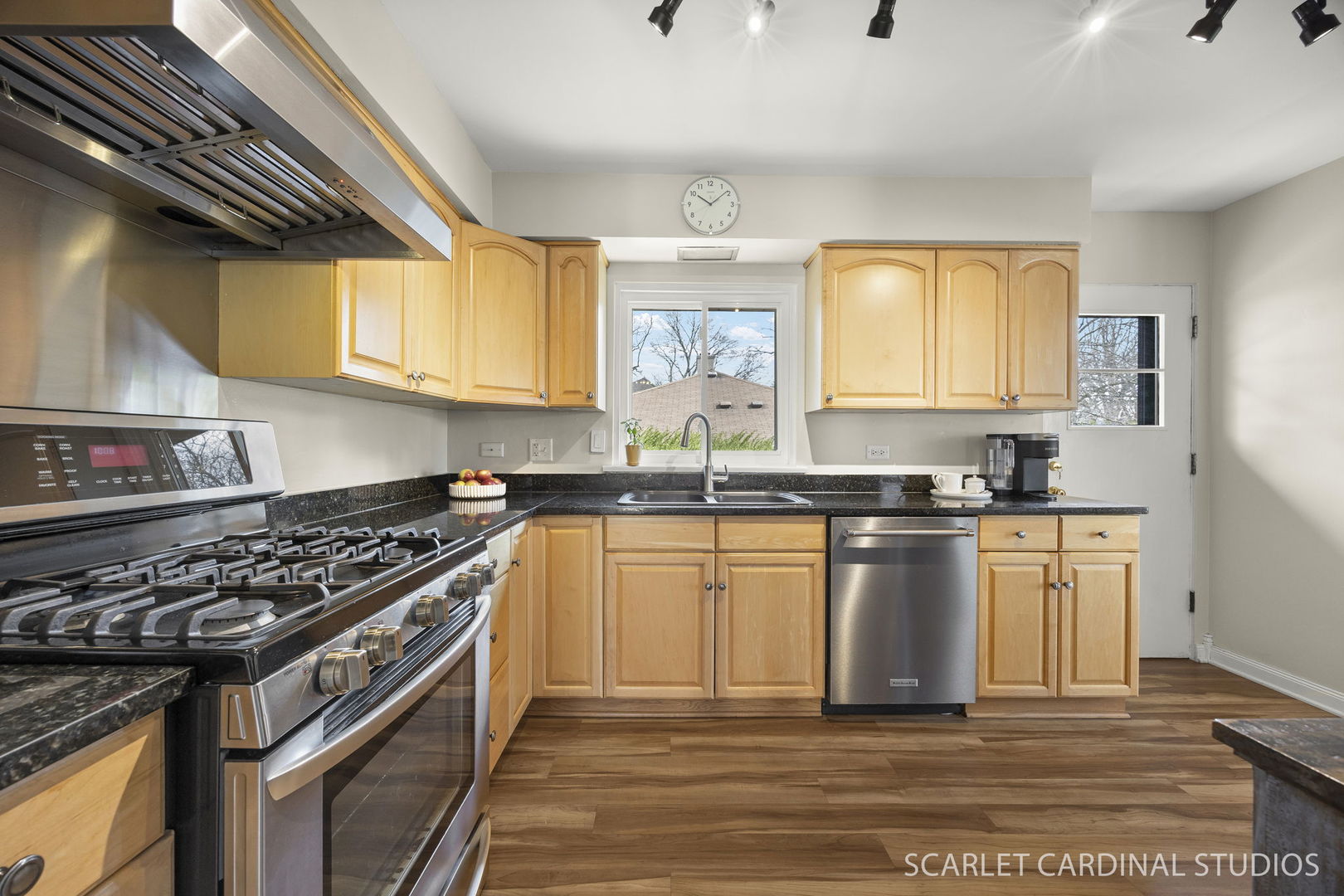 9 Notre Dame Drive Naperville, IL 60540 - Photo 8 of 24 a kitchen with stainless steel appliances granite countertop a stove a sink and a microwave