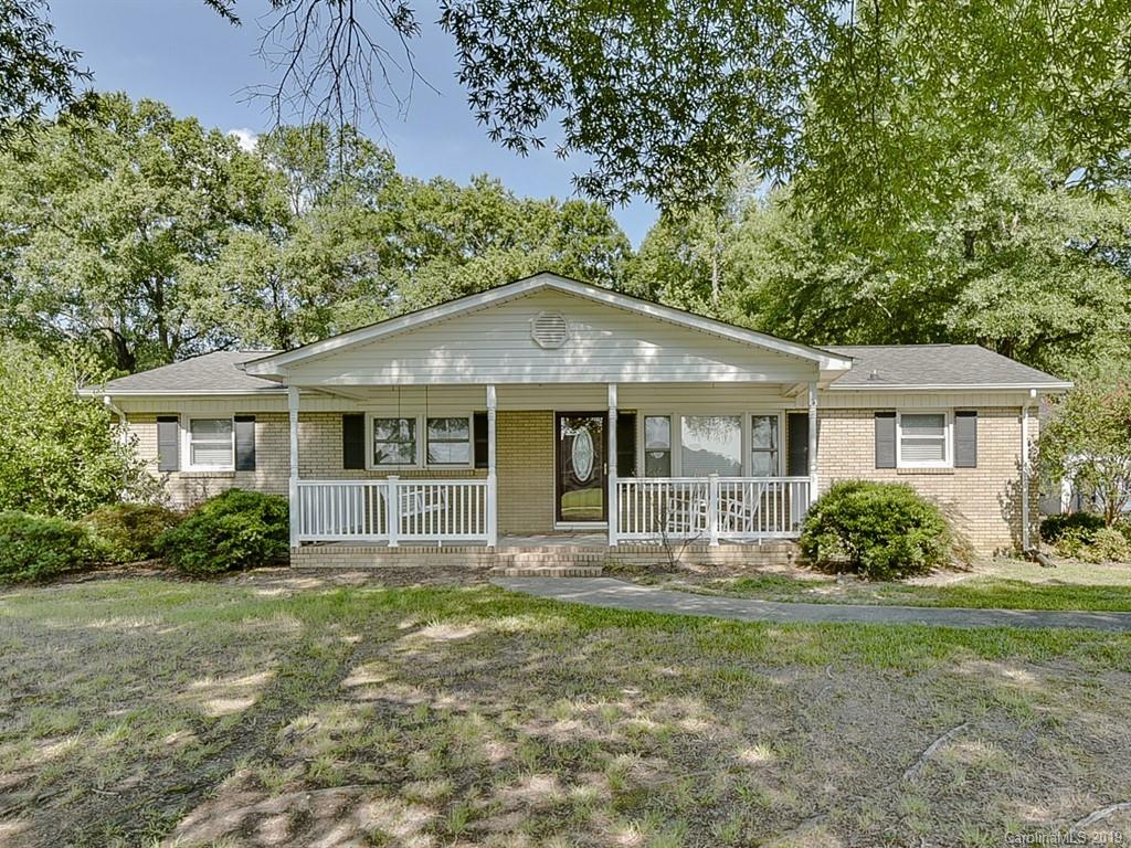 507 Sikes Mill Road Monroe, NC 28110 - Photo 2 of 40 a front view of a house with garden