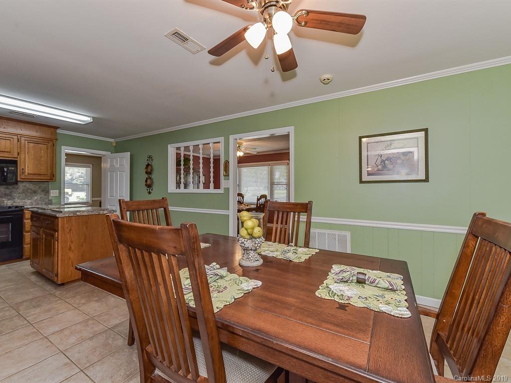 507 Sikes Mill Road Monroe, NC 28110 - Photo 17 of 40 a view of a dining room with furniture window and wooden floor