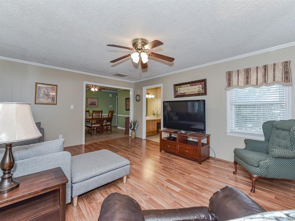 507 Sikes Mill Road Monroe, NC 28110 - Photo 20 of 40 a living room with furniture and a flat screen tv