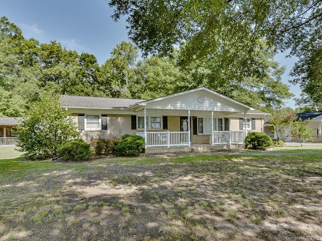 507 Sikes Mill Road Monroe, NC 28110 - Photo 3 of 40 a front view of a house with a yard
