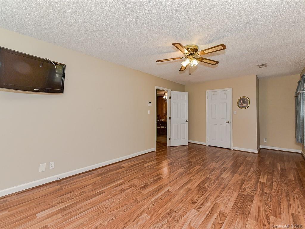 507 Sikes Mill Road Monroe, NC 28110 - Photo 23 of 40 a view of a livingroom with a flat screen tv