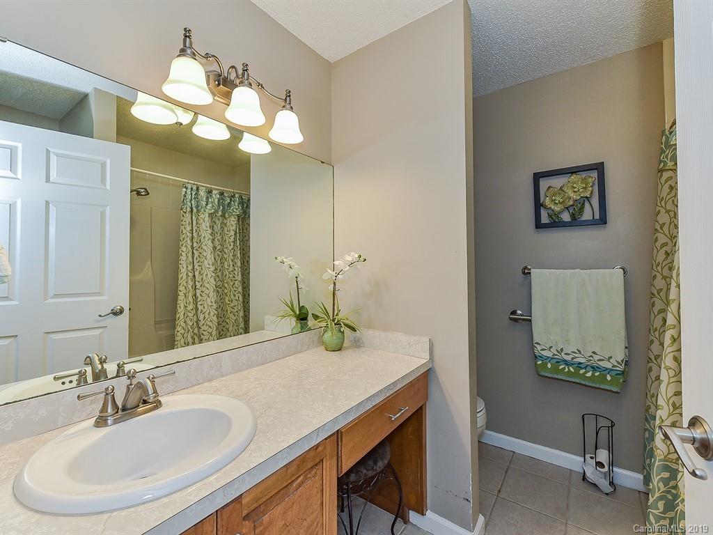 507 Sikes Mill Road Monroe, NC 28110 - Photo 28 of 40 a bathroom with a sink and a mirror