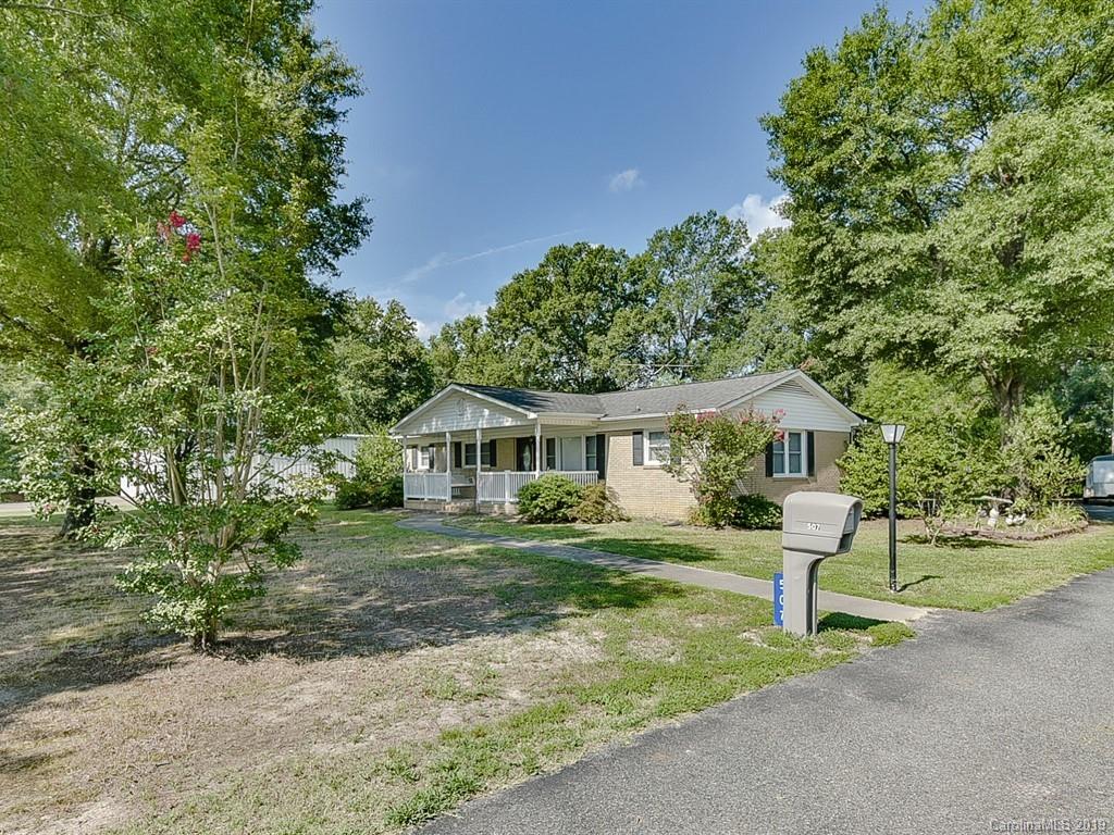 507 Sikes Mill Road Monroe, NC 28110 - Photo 4 of 40 a front view of a house with a garden