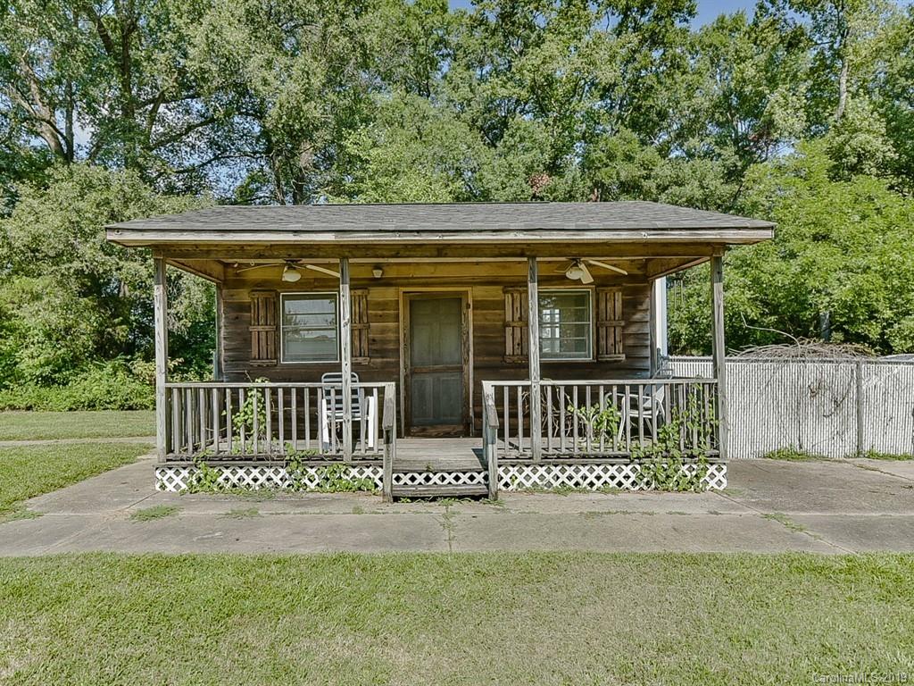 507 Sikes Mill Road Monroe, NC 28110 - Photo 33 of 40 a front view of a house with a garden