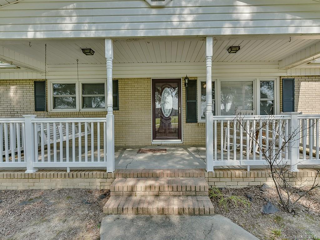 507 Sikes Mill Road Monroe, NC 28110 - Photo 5 of 40 a view of a house with a porch