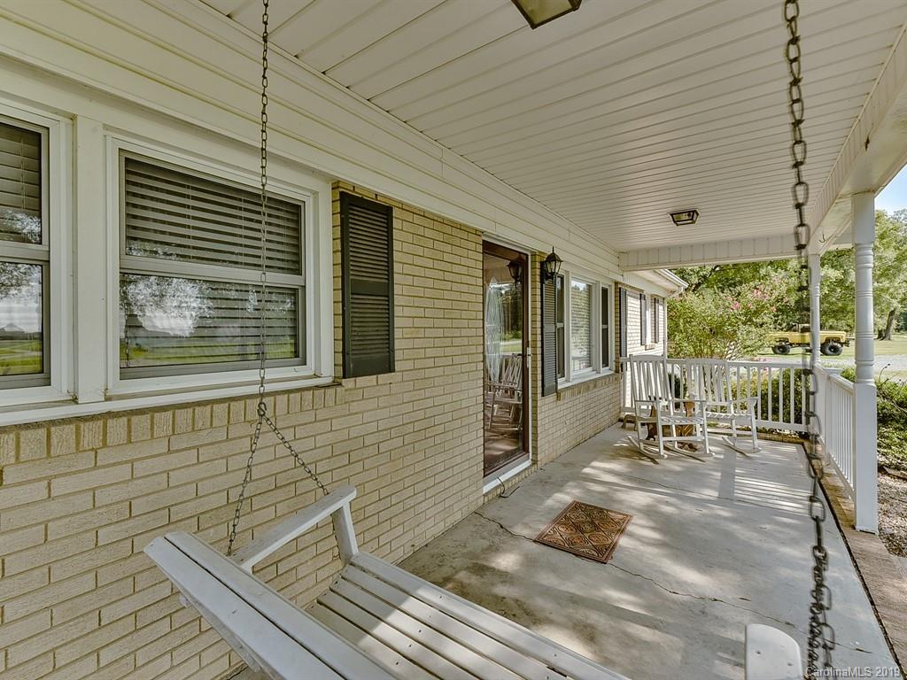 507 Sikes Mill Road Monroe, NC 28110 - Photo 6 of 40 a porch with seating space