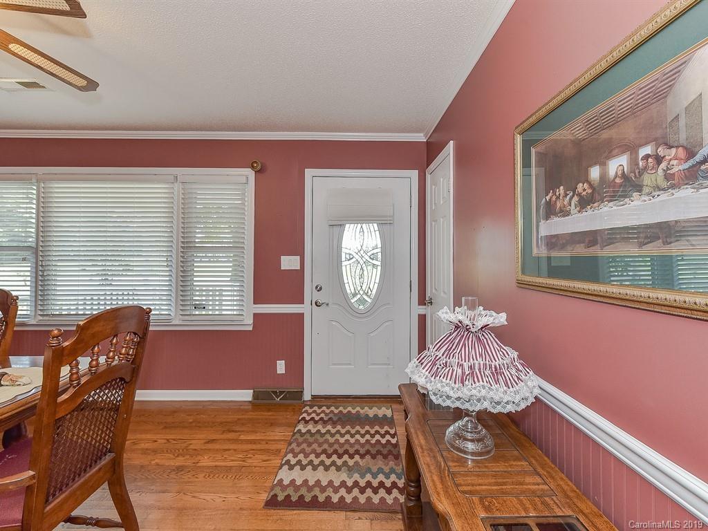 507 Sikes Mill Road Monroe, NC 28110 - Photo 8 of 40 a bedroom with a bed and wooden floor