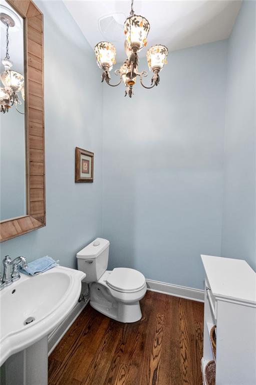 360 Chambers Street, Unit 402 Woodstock, GA 30188 - Photo 18 of 37 a bathroom with a sink a toilet and a mirror